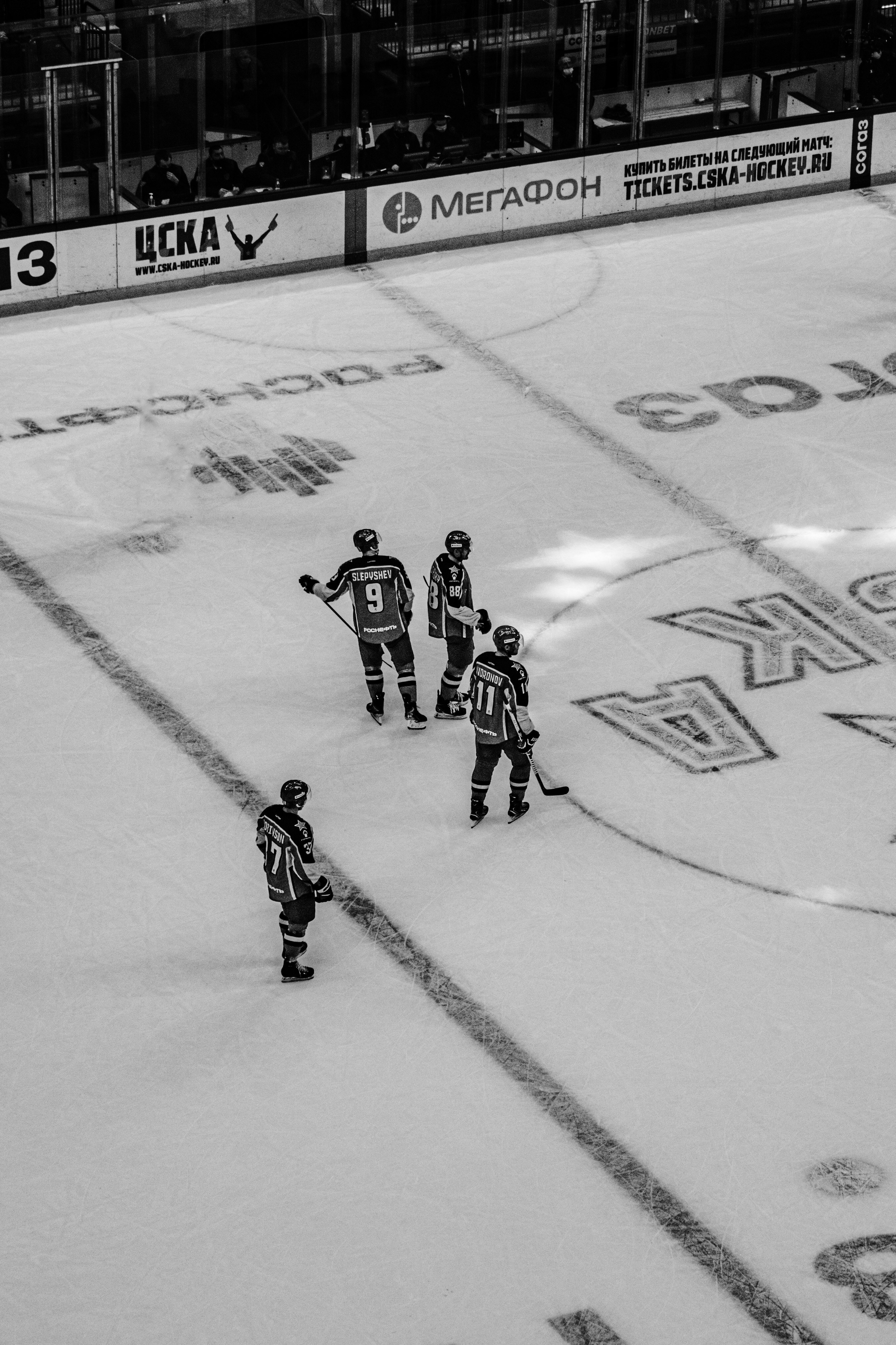 2 men playing ice hockey